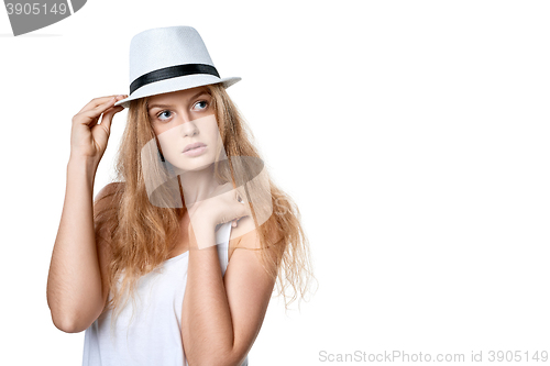Image of Beautiful slytish woman posing in fedora hat