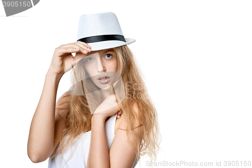 Image of Beautiful slytish woman posing in fedora hat