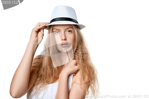 Image of Beautiful slytish woman posing in fedora hat