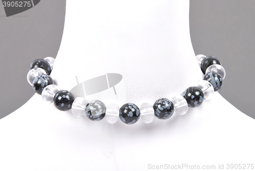 Image of Rock crystal and snowflake obsidian chain on bust