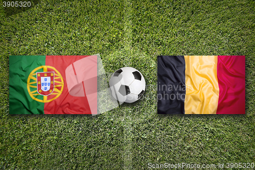 Image of Portugal vs. Belgium flags on soccer field