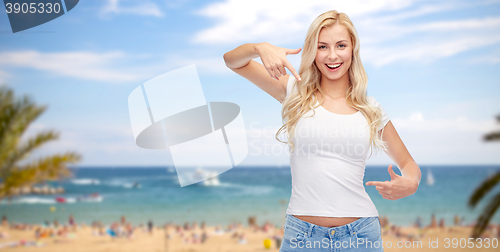 Image of happy young woman or teenage girl in white t-shirt