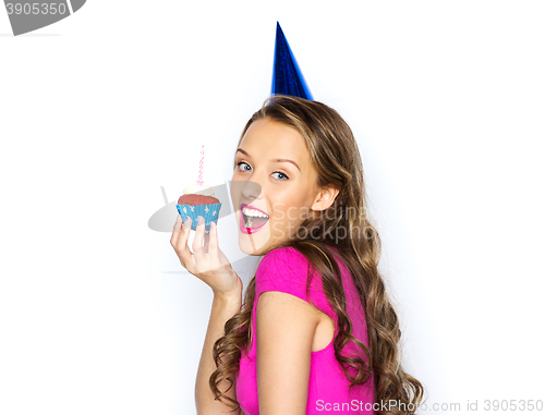 Image of happy woman or teen girl with birthday cupcake