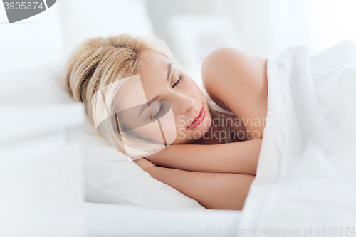 Image of young woman sleeping in bed at home bedroom