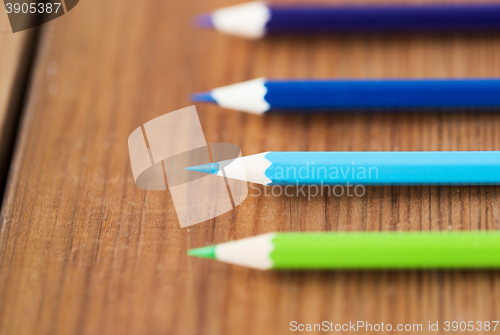 Image of close up of crayons or color pencils on wood