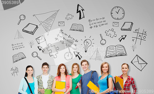 Image of group of teenage students with folders and bags