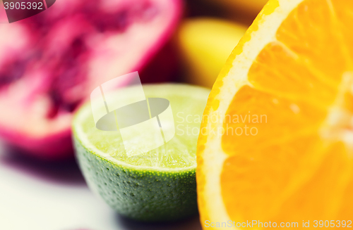 Image of close up of fresh juicy orange and lime