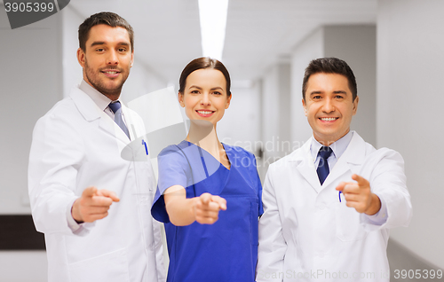 Image of group of medics pointing finger on you at hospital