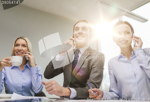 Image of business team with smartphones having conversation