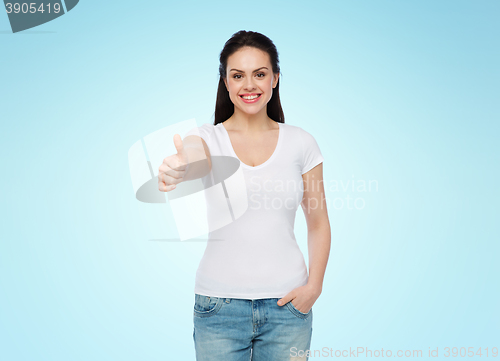 Image of happy womanin white t-shirt showing thumbs up