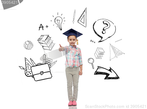 Image of happy girl in bachelor hat showing thumbs up