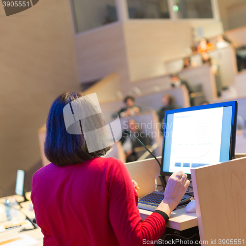 Image of Female speaker at Business Conference.