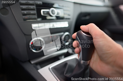 Image of Driver shifting the gear stick