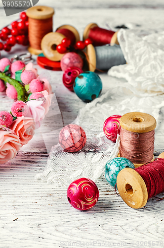 Image of Beautiful beads and spool of thread