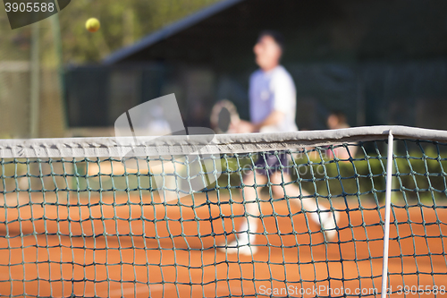 Image of Tennis net Man plays tennis