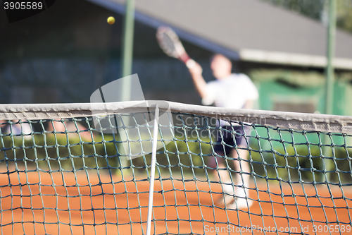 Image of Tennis net Man plays tennis