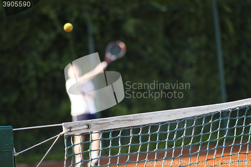 Image of Tennis net Man plays tennis