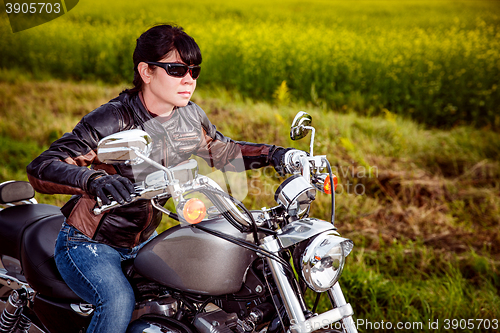 Image of Biker girl on a motorcycle