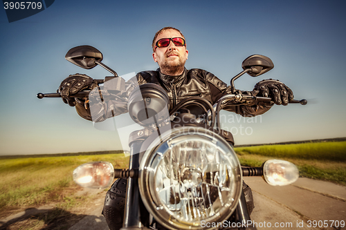 Image of Biker racing on the road