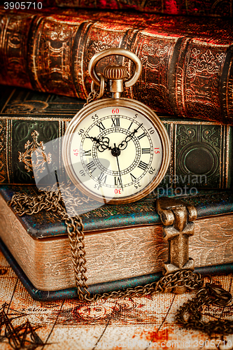 Image of Old Books and Vintage pocket watch