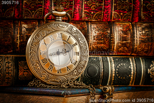 Image of Old Books and Vintage pocket watch