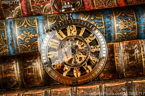 Image of Old Books and Vintage pocket watch