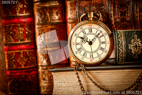 Image of Old Books and Vintage pocket watch