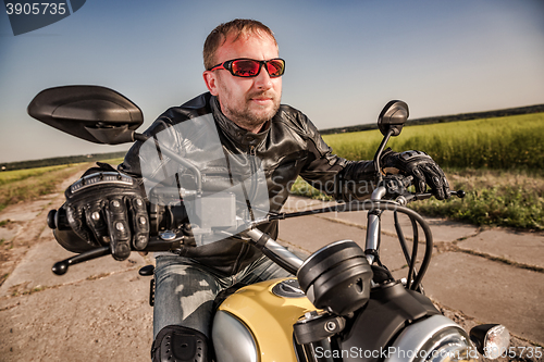 Image of Biker racing on the road