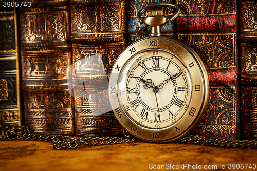 Image of Old Books and Vintage pocket watch