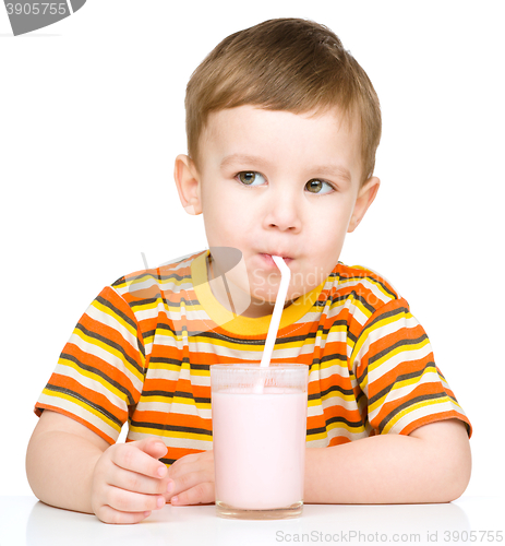 Image of Cute little boy with a glass of milk