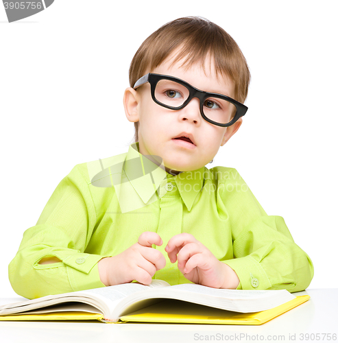 Image of Little child play with book