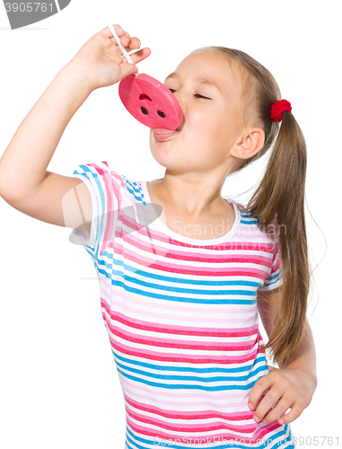 Image of Little girl with lollipop