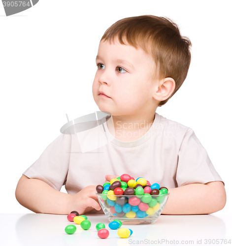 Image of Portrait of a boy with candies