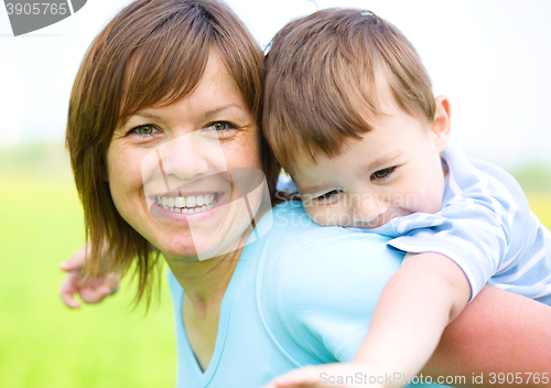 Image of Mother is playing with her son