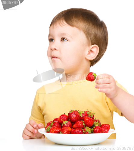 Image of Little boy with strawberries