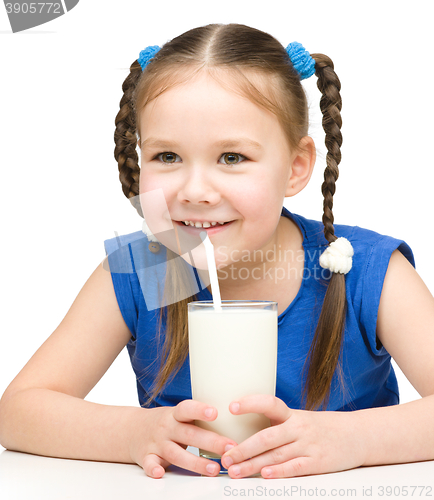 Image of Cute little girl with a glass of milk