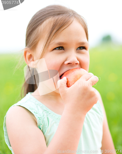 Image of Portrait of a little girl with apple