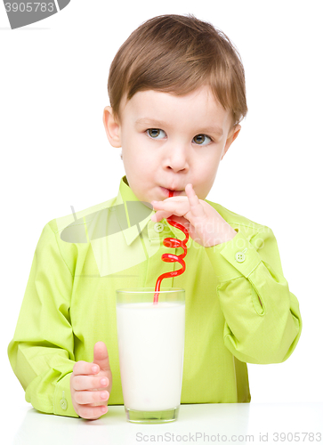 Image of Cute little boy with a glass of milk