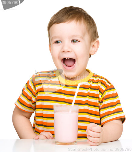 Image of Cute little boy with a glass of milk