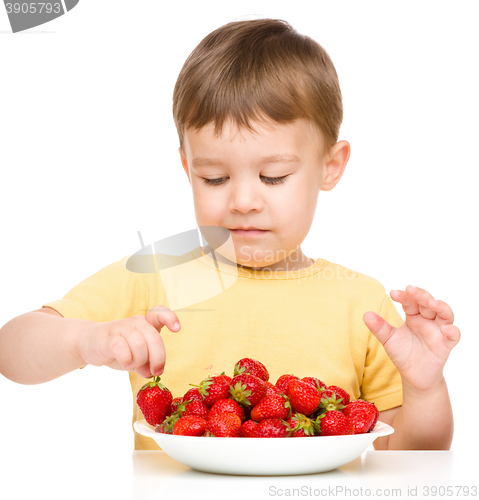 Image of Little boy with strawberries