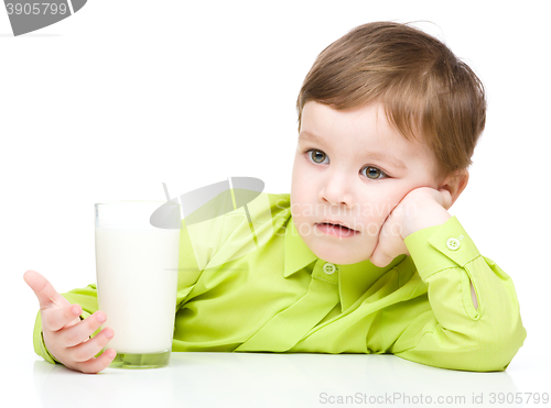 Image of Cute little boy with a glass of milk