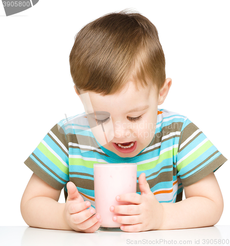 Image of Cute little boy with a glass of milk