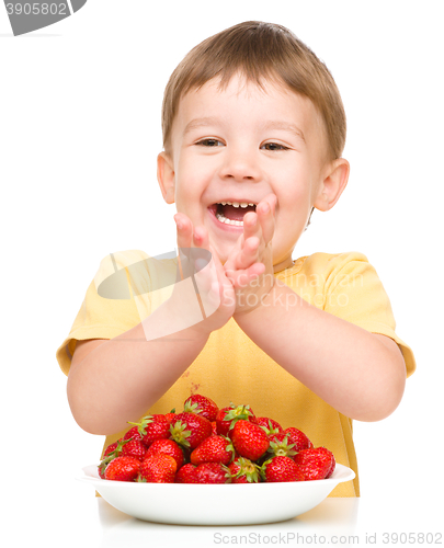 Image of Little boy with strawberries