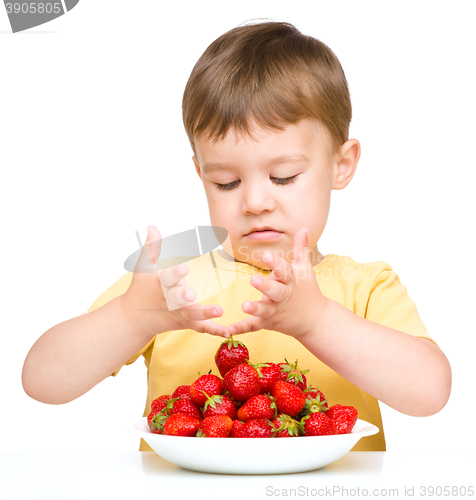 Image of Little boy with strawberries