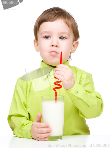 Image of Cute little boy with a glass of milk