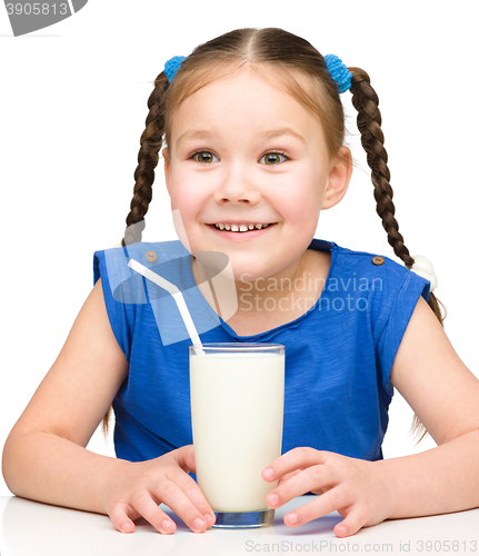 Image of Cute little girl with a glass of milk