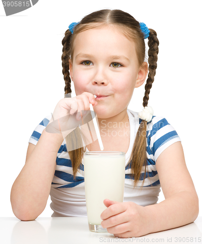 Image of Cute little girl with a glass of milk