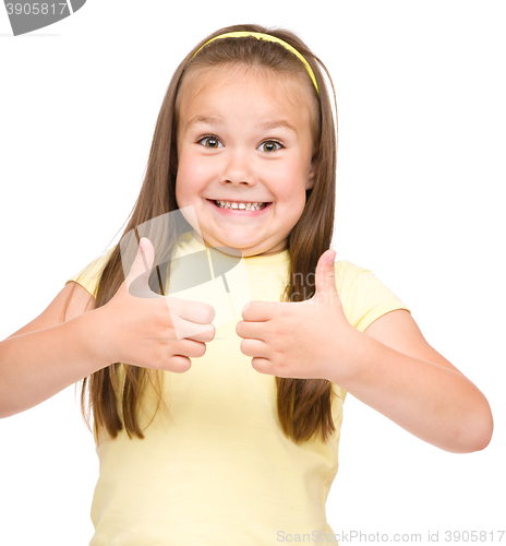 Image of Little girl is showing thumb up gesture