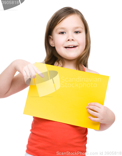 Image of Little girl is holding blank banner