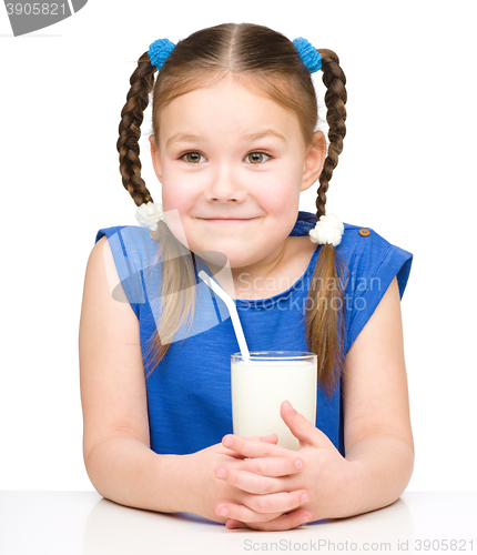 Image of Cute little girl with a glass of milk